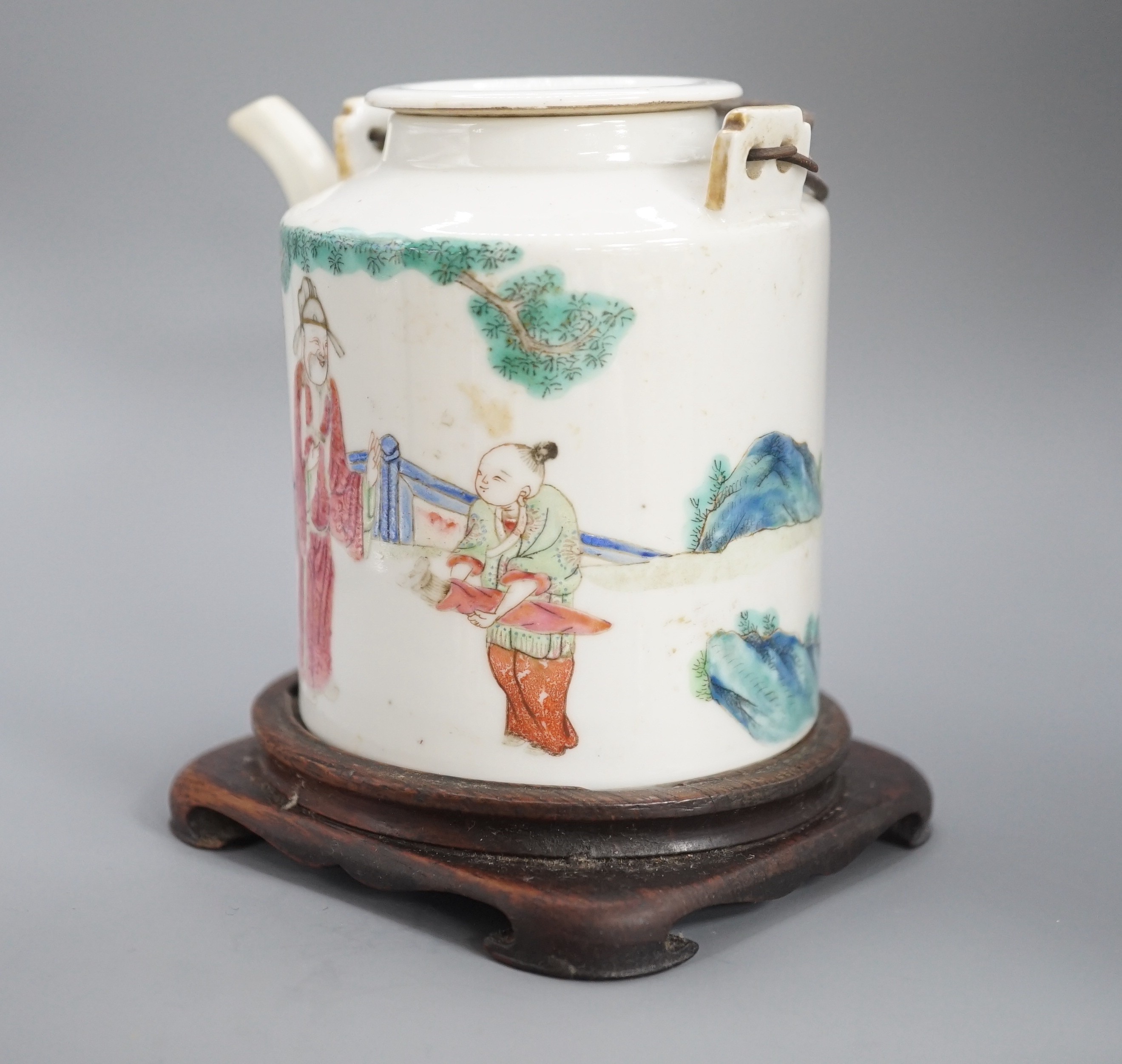 A Chinese famille rose cylindrical teapot and cover, 19th century 11cm, wood stand